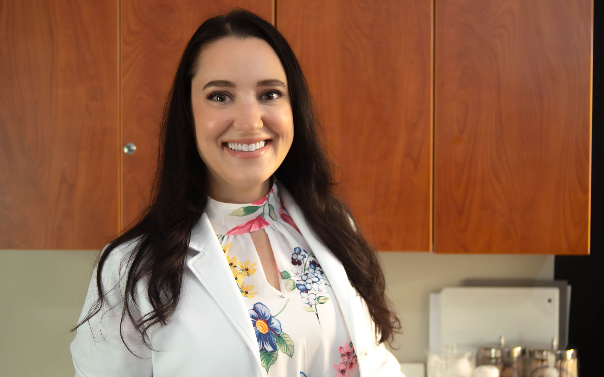 smiling female physician brown hair