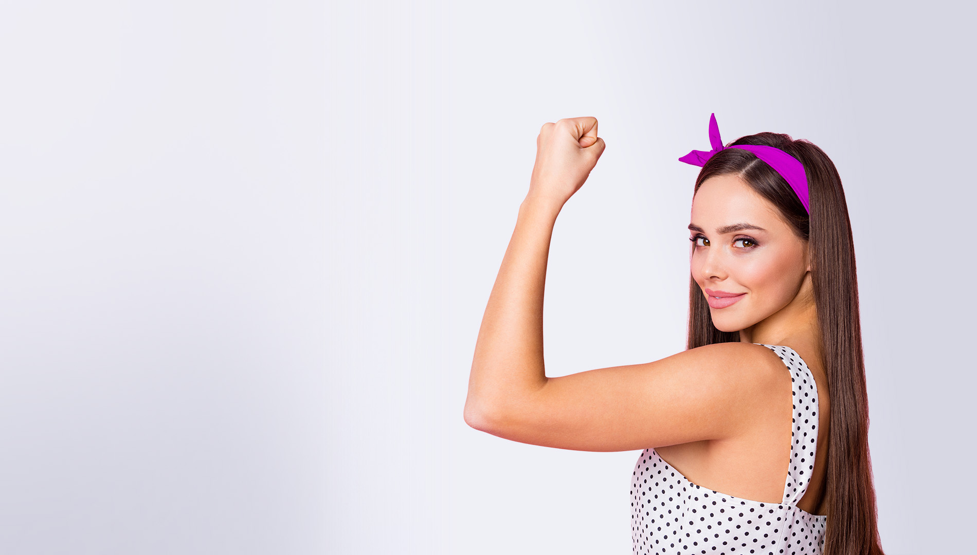 attractive brunette flexing arm