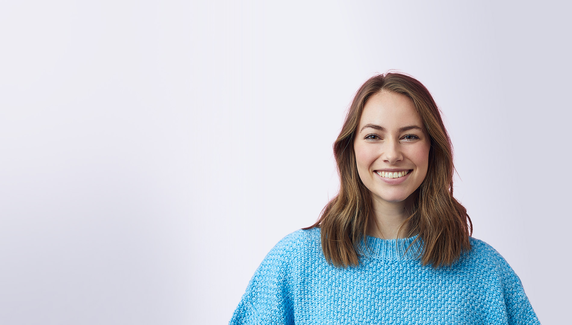 beautiful smiling woman wearing blue sweater