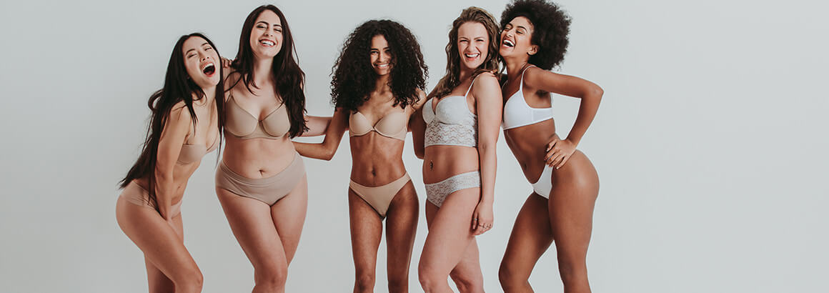 group of woman different body shapes laughing