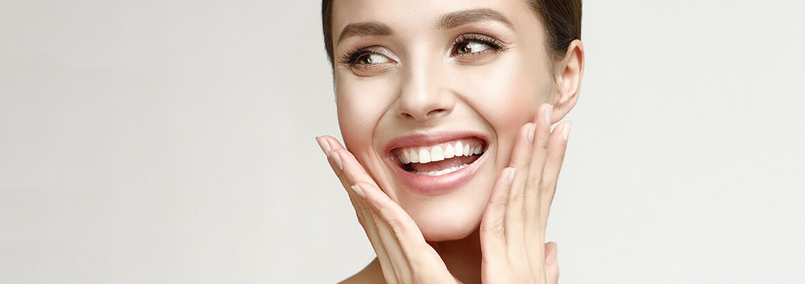 young woman hands on face