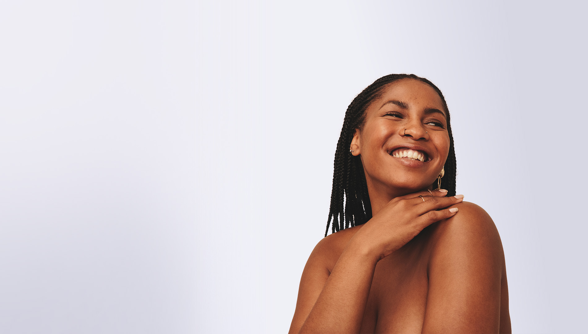 Cheerful black woman looking away with a smile