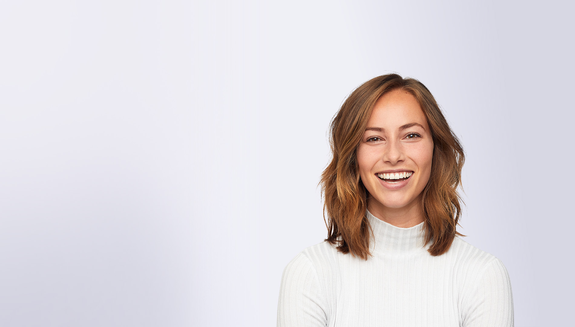 young happy woman wearing white sweater